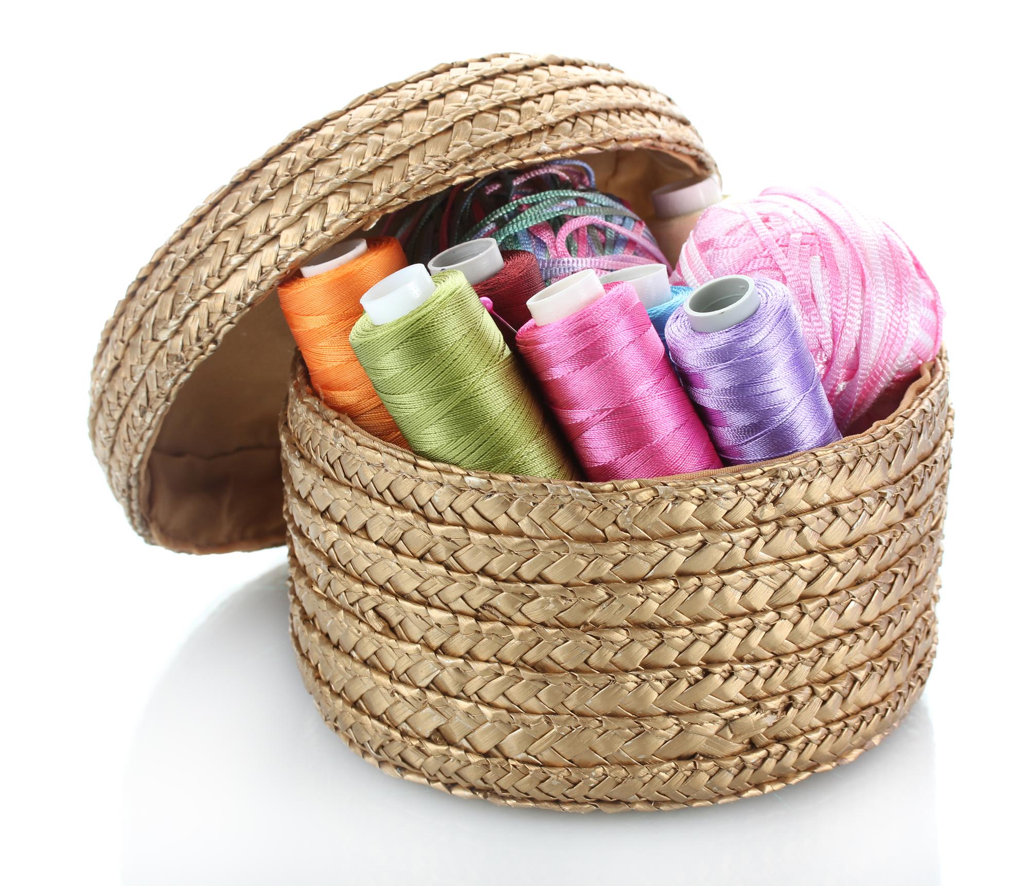 Assorted embroidery threads in wooden box